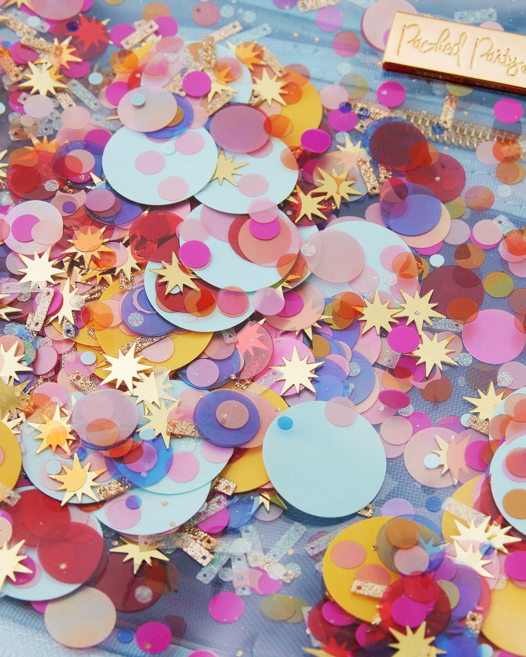 Confetti-filled travel cosmetic case measuring 11.5 by 3.5 by 8.5 inches