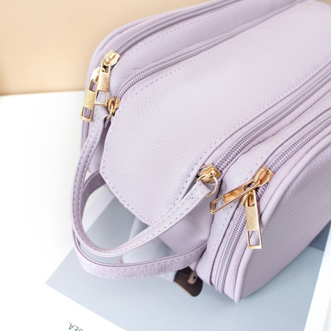 Structured makeup bag with secure zippered closure