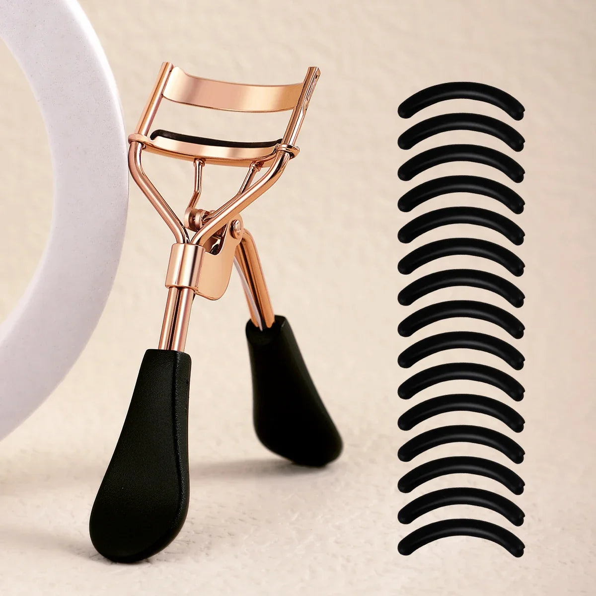 Eyelash curler with 15 refill pads